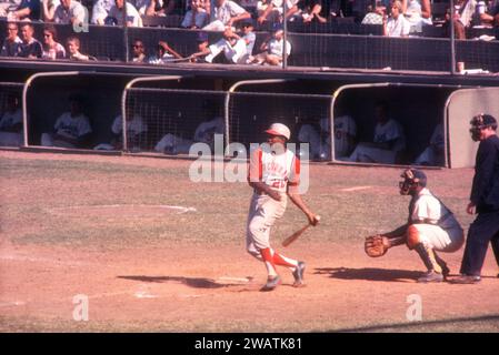 LOS ANGELES, CA - JULY 9:  Frank Robinson #20 of the Cincinnati Reds swings at the pitch as catcher John Roseboro #8 of the Los Angeles Dodgers and umpire Dusty Boggess look on during an MLB game on July 9, 1961 at the Los Angeles Memorial Coliseum in Los Angeles, California.  (Photo by Hy Peskin) *** Local Caption *** Frank Robinson;John Roseboro;Dusty Boggess Stock Photo