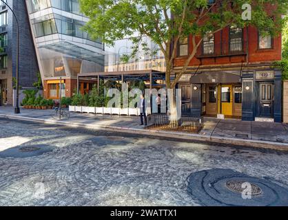 In form and finish, The Standard East Village hotel (former Cooper Square Hotel) has similarities to the Frank Gehry-designed IAC Building. Stock Photo