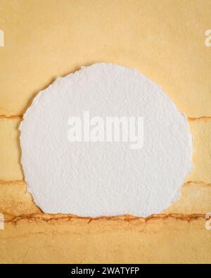 moon or sun rising over abstract  landscape, blank circular watercolor paper Stock Photo