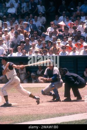 PITTSBURGH, PA - JUNE 26:  Gino Cimoli #20 of the Pittsburgh Pirates swings at the pitch as Jim Hegan #41 of the Chicago Cubs and umpire Vinnie Smith set up behind the plate during an MLB game on June 26, 1960 at Forbes Field in Pittsburgh, Pennsylvania.  (Photo by Hy Peskin) *** Local Caption *** Gino Cimoli;Jim Hegan;Vinnie Smith Stock Photo