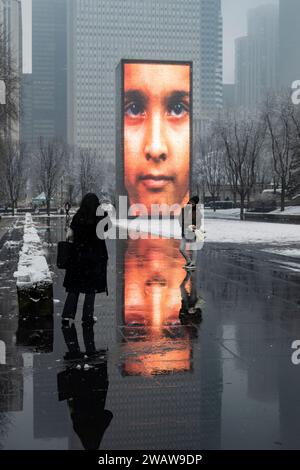 Chicago, USA.  6 January 2024.  Chicago weather : Crown Fountain, an interactive public artwork and video sculpture designed by Spanish artist Jaume Plensa, is seen beneath low clouds as the first significant snow falls in the city.  Before the snowfall, the weather has been unseasonably warm, but further heavier snow is forecast next week.  Credit: Stephen Chung / Alamy Live News Stock Photo