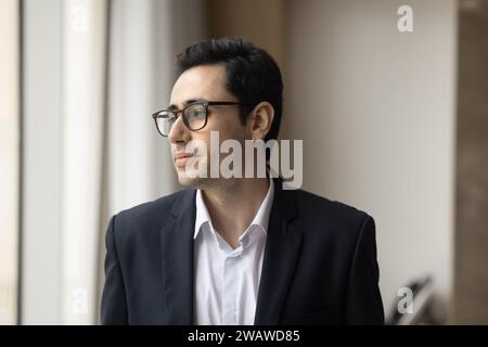 Thoughtful young Arab business man thinking on work problems solving Stock Photo