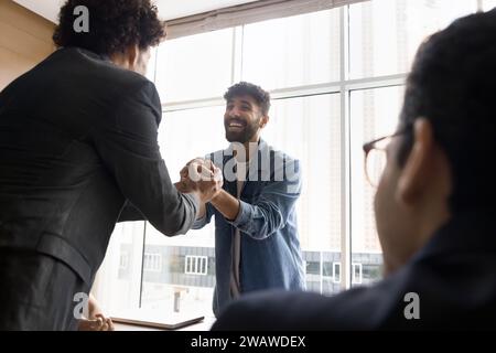 Positive excited project managers celebrating team success Stock Photo