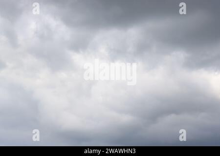 Full frame shot of dramatic sky and dark rain clouds. Stock Photo