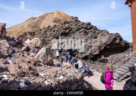 Mount Teide, Tenerife, Spain - 04.12.2023: Tourists on hiking trail at Mirador del Teide in Teide National Park, Tenerife, Canary Islands, Spain Stock Photo