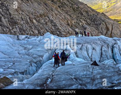 Hikers on a glacier trek on the Great Aletsch Glacier, UNESCO World Heritage Swiss Alps Jungfrau-Aletsch, Valais, Switzerland Stock Photo