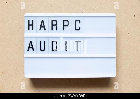 Lightbox with word HARPC (Hazard analysis and risk-based preventive controls) audit on wood background Stock Photo