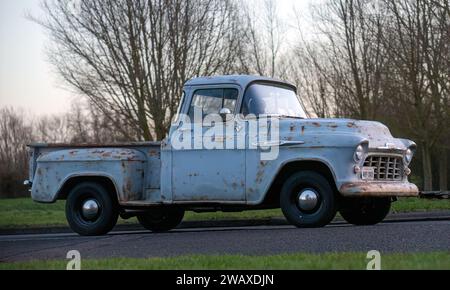 Stony Stratford,UK Jan 1st 2024. 1957 Chevrolet pick up truck car arriving at Stony Stratford for the annual New Years Day vintage and classic vehicle Stock Photo