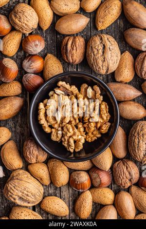 Peeled dried walnut kernels in the bowl. Top view. Stock Photo
