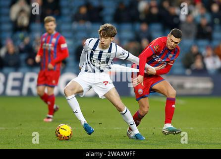 West Bromwich Albion's Harry Whitwell (left) and Aldershot Town's Stuart O'Keefe battle for the ball during the Emirates FA Cup Third Round match at The Hawthorns, West Bromwich. Picture date: Sunday January 7, 2024. Stock Photo