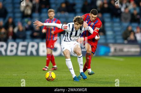 West Bromwich Albion's Harry Whitwell (left) and Aldershot Town's Stuart O'Keefe battle for the ball during the Emirates FA Cup Third Round match at The Hawthorns, West Bromwich. Picture date: Sunday January 7, 2024. Stock Photo