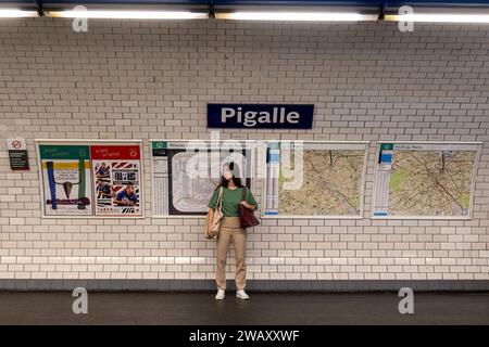 Woman at the Pigalle stop of the Paris metro, Paris, France, Europe Stock Photo