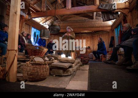 A woman dressed in Sami clothes shows some ways of preserving products ...