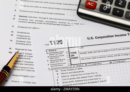 Corporation income tax form 1120. Tax reform, corporate tax code, and tax evasion concept. Stock Photo