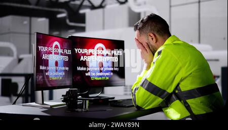 Shocked Engineer In Automated Semiconductor Factory During Ransomware Attack Stock Photo