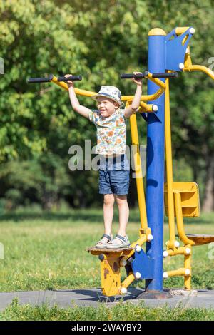 The Little Boy Does Exercise of Pose Locust in Autumn Park. Children`s Yoga  Outdoors Stock Image - Image of fitness, activity: 159164177