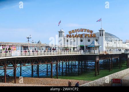BRIGHTON, UK - 11TH MAY 2023: Part of the Brighton Palace Pier, showing lots of people on the walkway. Stock Photo