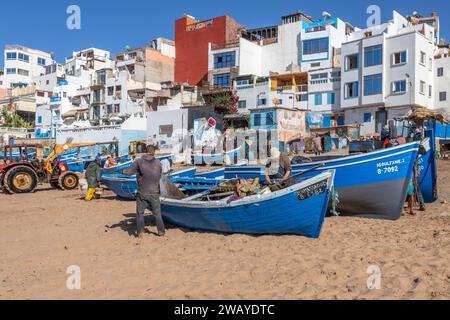 Small, Blue, Wooden Fishing Boats on the Beach in Taghazout, Morocco, North Africa Stock Photo