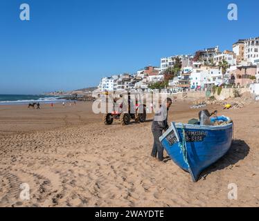 Small, Blue, Wooden Fishing Boats on the Beach in Taghazout, Morocco, North Africa Stock Photo