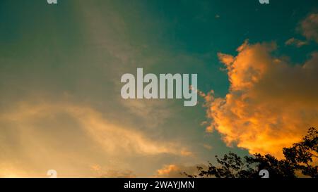 Real amazing panoramic sunset sky with gentle colorful clouds Stock Photo