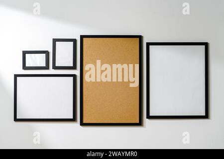 Set of black frames on white wall with copy space Stock Photo