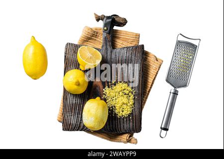 Raw grated Lemon Zest peel on wooden board. Isolated on white background, top view Stock Photo
