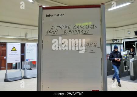 London, UK. 7th January, 2024. A sign at Morden Station informs passengers that a scheduled strike is cancelled. A London Underground tube strike by Rail, Maritime and Transport Union (RMT) members was called off at the last minute after continued negotiations with Transport for London (TfL). The strikes were set to cause disruption across the network after workers turned down the 5% pay increase. Passengers are told to still expect some delays to their journeys tomorrow. Credit: Eleventh Hour Photography/Alamy Live News Stock Photo