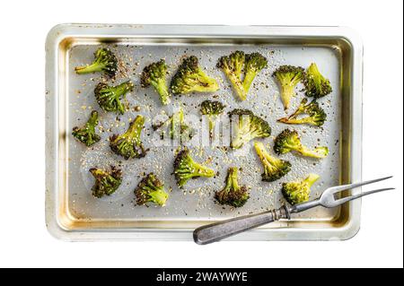 Roasted broccoli cabbage with garlic in baking tray. Isolated on white background, top view Stock Photo