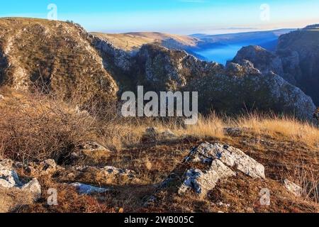 fog over limestone gorge in Transylvania, Cheile Turenilor in late autumn Stock Photo