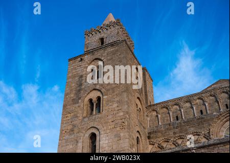 Cefalu, Sicily, Italy, December 19, 2023 - Tower of the Cefalu cathedral against blue sky Stock Photo