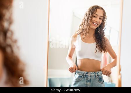 Woman pulling down pants hi-res stock photography and images - Alamy