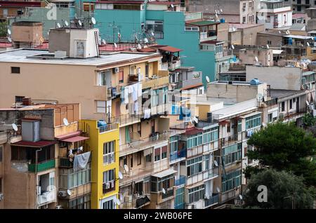 Aranella, Sicily, Italy, December 16, 2023 - High angle view over worn-out apartment blocks at the coast Stock Photo