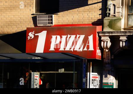 A New York City pizza shop with the words $1 Pizza on the awning Stock Photo