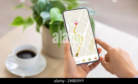 Cropped of woman using navigation mobile app on smartphone Stock Photo