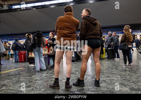Participants without pants ride on a journey at London Underground. Participants of the 'No Trousers Tube Ride' are seen acting normal without wearing trousers while riding on London underground. 'No Trousers Tube Ride' returned to London despite a London Underground strike has been announced and starting from this evening. (Photo by Hesther Ng / SOPA Images/Sipa USA) Stock Photo
