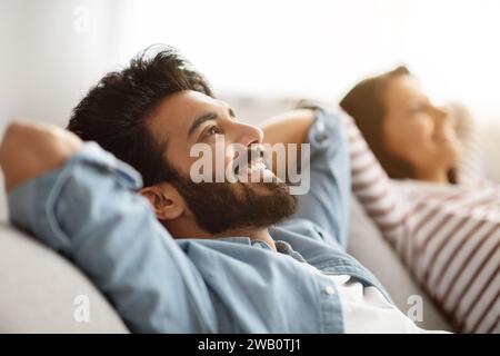 Portrait of relaxed young indian man relaxing at home Stock Photo