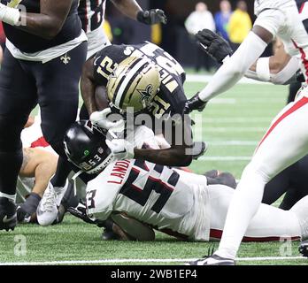 New Orleans, USA. 07th Jan, 2024. New Orleans Saints running back Jamaal Williams (21) tries to gain some extra yardage while being tackled by Atlanta Falcons linebacker Nate Landman (53) during a National Football League game at Caesars Superdome in New Orleans, Louisiana on Sunday, January 7, 2024. (Photo by Peter G. Forest/Sipa USA) Credit: Sipa USA/Alamy Live News Stock Photo