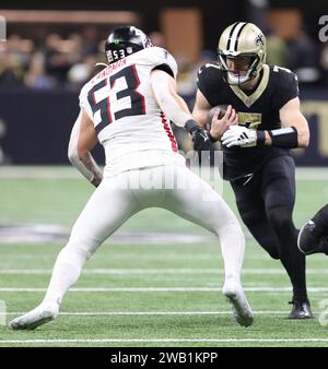 New Orleans, USA. 07th Jan, 2024. New Orleans Saints quarterback Taysom Hill (7) tries to run past Atlanta Falcons linebacker Nate Landman (53) during a National Football League game at Caesars Superdome in New Orleans, Louisiana on Sunday, January 7, 2024. (Photo by Peter G. Forest/Sipa USA) Credit: Sipa USA/Alamy Live News Stock Photo