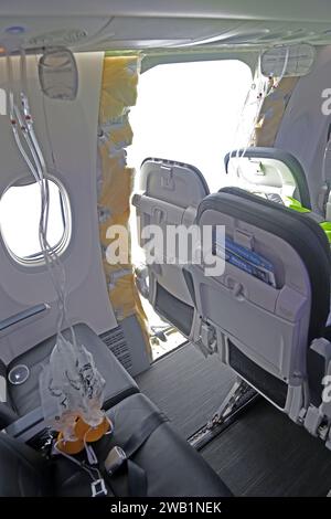 NTSB investigation of the Jan. 5 accident involving Alaska Airlines Flight 1282 on a Boeing 737-9 MAX. NTSB investigators in the aircraft cabin, near the hole in the fuselage where the door plug failed. Stock Photo