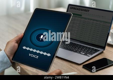 A voice recording man holding his smartphone screen generates AI technology for language and communication in a mobile application. Record sound Stock Photo