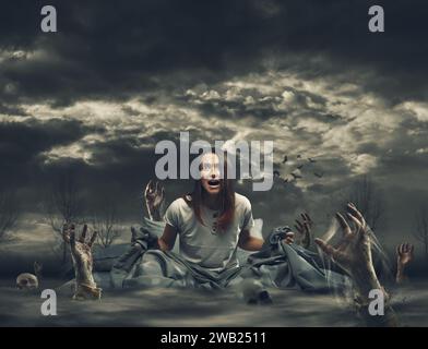 Terrified young woman in her bed surrounded by zombies, horror and nightmares concept Stock Photo