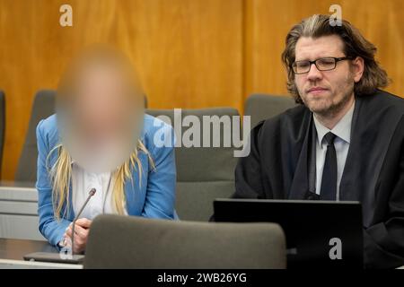 Essen, Germany. 08th Jan, 2024. The defendant sits next to her lawyer David Bleikamp in the courtroom. She is alleged to have given her grandmother two drinks in March and July 2023, which are said to have been laced with a high dose of sedatives. According to the indictment, the 31-year-old was after her grandmother's assets and inheritance. Credit: Christoph Reichwein/dpa - ATTENTION: Person was pixelated by order of the court for legal reasons/dpa/Alamy Live News Stock Photo