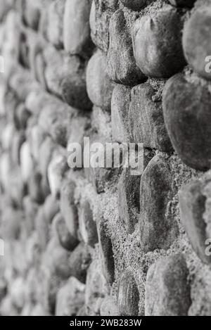 A closeup of a stone wall texture in grayscale Stock Photo