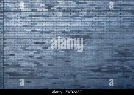 A cool modern grey-blue brick wall background Stock Photo