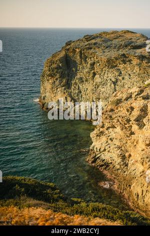 Large rock formation at sunset on the coastline of Crete Stock Photo