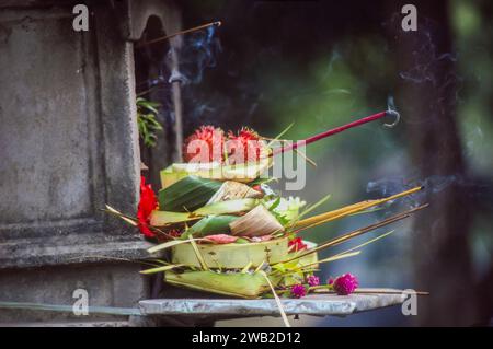 Indonesia, Bali -  offerings to hindu gods in a small shrine. Stock Photo