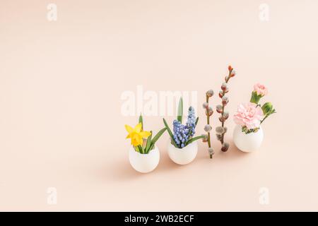 Happy easter card. Still life with eggs, willow, flowers. Minimal Stock Photo