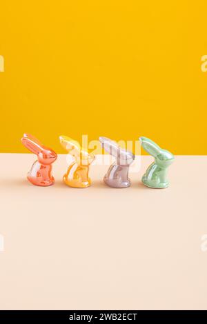 easter Rabbits Decor On yellow background . Minimal. Text space Stock Photo