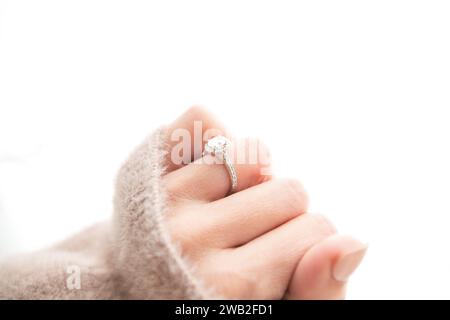 Halo Diamond Ring on Woman's Closed Hand Stock Photo