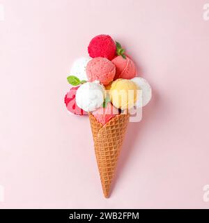 vibrant various ice cream balls scoops stacked in a waffle cone Stock Photo